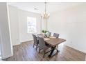 Clean dining room featuring modern table, stylish chairs and a chandelier at 333 Flyway Rd, Goose Creek, SC 29445