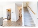 Bright entryway features staircase, wood floors, and a view into the kitchen at 333 Flyway Rd, Goose Creek, SC 29445