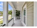 Inviting porch with stylish columns, offering a view of the neighborhood and a bright, open feel at 3447 Yarmouth Dr, Mount Pleasant, SC 29466