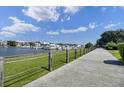 Scenic waterfront view of boats docked near a lush green walkway, providing a tranquil coastal living experience at 40 41St Ave # E8, Isle of Palms, SC 29451