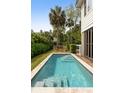 Backyard featuring a private in-ground pool, stone border, and lounge chairs at 407 Pitt St, Mount Pleasant, SC 29464