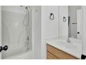 Spotless bathroom features a shower-tub combo, modern fixtures, and vanity with a wood cabinet and sink at 4856 Cane Pole Ln, Summerville, SC 29485