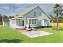 Back exterior of home with optional pool and patio space perfect for outdoor relaxation and entertainment at 5213 Seewee Rd, Awendaw, SC 29429