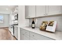 Bright kitchen featuring white countertops and subway tile backsplash, alongside modern appliances at 549 Richfield Way Way, Summerville, SC 29486