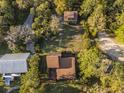 Stunning aerial view of the estate showing proximity to a guest house and lush landscaping at 7897 Russell Creek Dr, Edisto Island, SC 29438