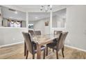 Elegant dining room showcases a marble-topped table and contemporary chandelier, perfect for Gathering gatherings at 9676 Godwin St, Ladson, SC 29456