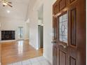 Inviting living room features hardwood floors, a fireplace, and a vaulted ceiling providing an open atmosphere at 103 Innisbrook Bnd, Summerville, SC 29483