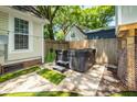Backyard featuring a modern hot tub with a privacy fence and low-maintenance landscaping at 1070 Blue Marlin Dr, Charleston, SC 29412