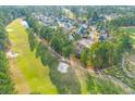 An expansive aerial shot shows the neighborhood's layout and the golf course-adjacent location at 1164 Out Of Bounds Dr, Summerville, SC 29485