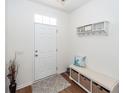 Welcoming foyer with hardwood floors, a storage bench, and a decorative shelf with hooks at 118 Alpine Rd, Summerville, SC 29485