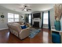 Spacious living room with hardwood floors, modern furnishings, and a bright, airy atmosphere at 138 Shadybrook Dr, Summerville, SC 29486