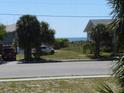 Charming beachside home with stunning ocean views and swaying palm trees at 1603 Lybrand St, Edisto Island, SC 29438