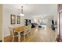 Open-concept living space featuring a dining area that flows into the living room, enhancing the home's bright atmosphere at 1984 Folly Rd # A307, Charleston, SC 29412