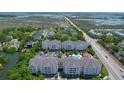 Aerial view of condo community with marsh views, roads, and landscaped grounds at 1984 Folly Rd # B114, Charleston, SC 29412