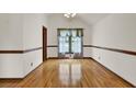 Elegant dining room featuring gleaming hardwood floors, natural light, and neutral walls at 204 Knightsbridge, Charleston, SC 29418