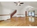 Spacious living room with gleaming hardwood floors and staircase, filled with natural light at 204 Knightsbridge, Charleston, SC 29418