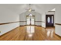 Bright living room featuring beautiful hardwood floors and an arched window at 204 Knightsbridge, Charleston, SC 29418