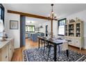 Open dining room with wood floors, modern decor, and a view into a bright kitchen at 205 Tea Farm Rd, Summerville, SC 29483