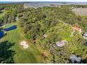 Overhead view of golf course community showing lush trees, ponds, and scenic views at 2355 Andell Way, Seabrook Island, SC 29455