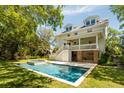 Backyard oasis with a sparkling pool, spa, and a relaxing patio area at 2802 Ion Ave, Sullivans Island, SC 29482