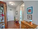 Inviting foyer with hardwood floors, soft gray walls, decorative furnishings and access to other rooms in the home at 301 Blakely Village Ln, Summerville, SC 29486