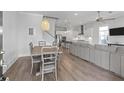 Open-concept living space with modern light fixtures and natural light at 3130 Sturbridge Rd, Mount Pleasant, SC 29466