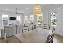 Bright and airy living room featuring a stylish light fixture at 3130 Sturbridge Rd, Mount Pleasant, SC 29466