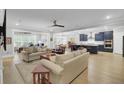Spacious living room with hardwood floors, comfortable seating, and an open floor plan at 3154 Hugh Bennett Dr, Johns Island, SC 29455