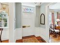 Bright foyer with hardwood floors and classic white trim at 32 Church St, Charleston, SC 29401