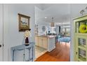 Inviting entryway with stylish decor leading into a modern kitchen and living area at 33 Calhoun St # 123, Charleston, SC 29401