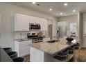 Well-appointed kitchen boasting stainless steel appliances, granite countertops, and a spacious island with bar seating at 331 Pine Crest View, Summerville, SC 29486