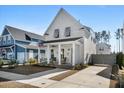 Exterior view of this charming home, showcasing its well-manicured lawn and convenient driveway at 371 Ripple Park Dr, Summerville, SC 29486