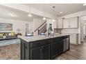Spacious kitchen island with seating and a view into the living area at 433 Thoroughbred Dr, Moncks Corner, SC 29461
