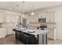 Bright kitchen features a large island with seating and modern appliances at 433 Thoroughbred Dr, Moncks Corner, SC 29461