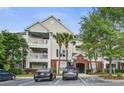 Well-maintained condo building with ample parking and mature landscaping at 45 Sycamore Ave # 1532, Charleston, SC 29407