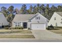 Charming one-story home featuring an attached garage and well-kept landscaping at 534 Four Seasons Blvd, Summerville, SC 29486