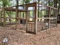 Large chicken coop with a secure enclosure, ensuring the safety of your flock at 5354 Ceva Dr, Hollywood, SC 29449