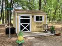 Charming outbuilding with a welcoming porch and decorative details, perfect for a studio or office at 5354 Ceva Dr, Hollywood, SC 29449