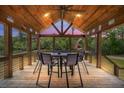 Inviting covered porch with dining area, ideal for entertaining at 5653 Wire Rd, Branchville, SC 29432