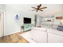 Cozy living room featuring a TV, comfortable seating, and an open view of the kitchen at 600 Bucksley Ln # 305, Charleston, SC 29492