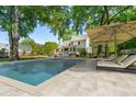A luxurious in-ground swimming pool with a surrounding patio area and comfortable lounge chairs at 679 Clearview Dr, Charleston, SC 29412