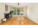 Inviting living room offers hardwood floors, a ceiling fan, and cozy fireplace at 700 Daniel Ellis Dr # 4104, Charleston, SC 29412