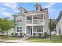 Charming two-story home featuring a double porch, well-maintained landscaping, and a welcoming entrance at 81 Crossandra Ave, Summerville, SC 29483