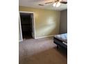 View of a bedroom with brown carpet, open door and bed frame at 10 Cranford Rd, Goose Creek, SC 29445