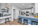 Stylish kitchen featuring granite counters, stainless steel appliances, and breakfast bar seating at 107 Tandil Ct, Summerville, SC 29483