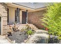 A welcoming front entrance with red brick steps and a landscaped garden area at 113 Dove Ln, Summerville, SC 29485