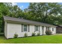 Charming white brick home features a well-maintained lawn and inviting curb appeal at 120 Lisa Dr, Summerville, SC 29485