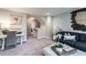 Cozy living room with comfortable seating, stylish decor, and ample natural light at 121 Royal Cainhoy Way, Huger, SC 29450