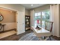 Bright office space featuring large windows, modern desk, and stylish decor at 121 Royal Cainhoy Way, Huger, SC 29450