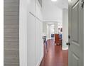 Bright foyer featuring pristine wainscoting and dark hardwood floors at 1300 Park West Blvd # 215, Mount Pleasant, SC 29466